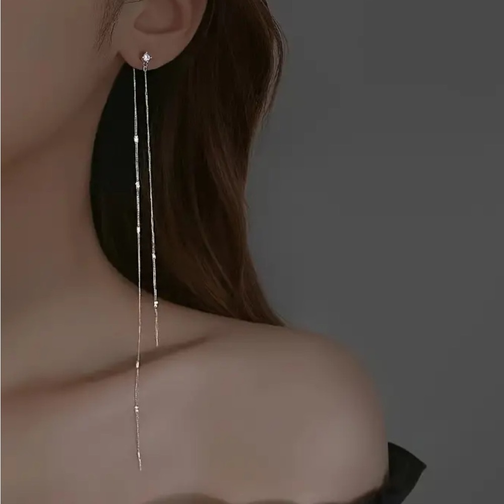 Womans long silver drops